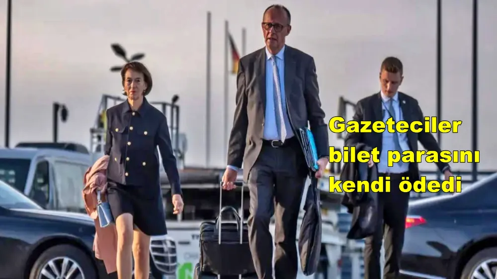 Alman Başbakan bavulu laptopu elinde Türkiye